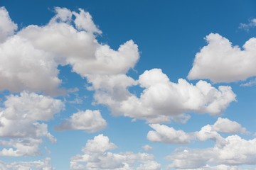 Cumulus clouds against blue sky