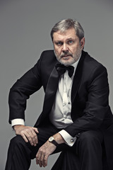 Senior Businessman sitting in chair