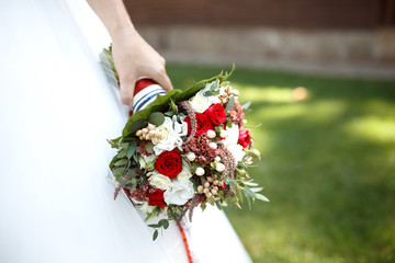 A bouquet in the hands of the bride