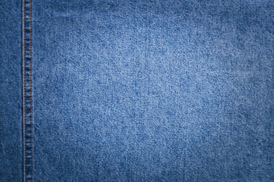 Blue Fabric Jeans With Copyspace For Text In Center On Blurred Background Around For Design.