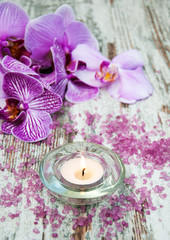 Candle with orchids