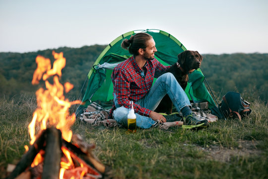 Man Traveling With Dog, Camping In Nature.