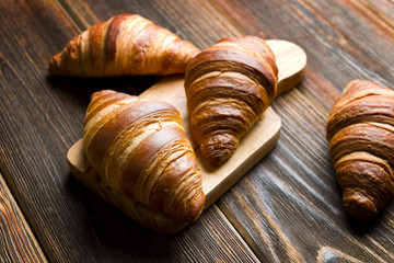 Fresh croissants on a wood