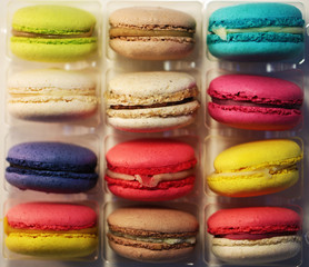 Macaroons of different colors packed in plastic bag