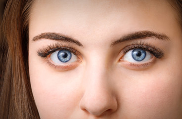 portrait of a young girl after the procedure to increase the length of eyelashes