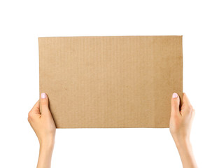 Hands holding a piece of cardboard. Isolated on a white background. Prepared for your text