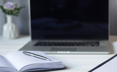 laptop and documents in the workplace.