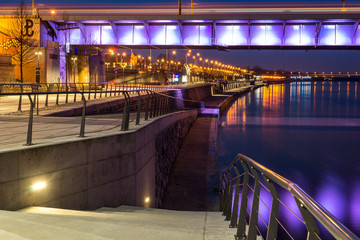 Fototapeta na wymiar Night view on the Slasko-Dabrowski bridge over the Vistula river and boulevards , Warsaw, Poland