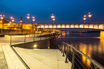 Night view on the Slasko-Dabrowski bridge over the Vistula river and boulevards , Warsaw, Poland