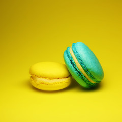 Bright food photography of macroons on yellow background