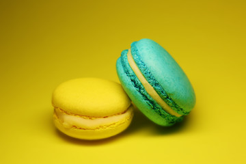 Bright food photography of macroons on yellow background