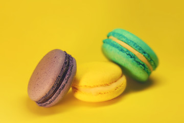 Bright food photography of macroons on yellow background