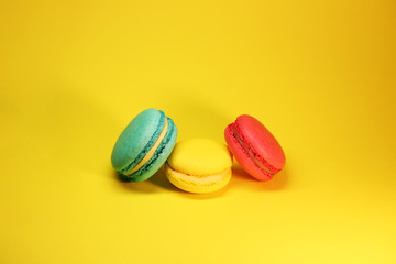 Bright food photography of macroons on yellow background