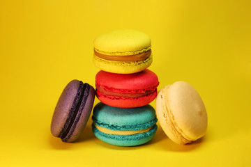 Bright food photography of macroons on yellow background