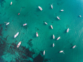 Fototapeta na wymiar Beautiful aerial view of boats and emerald water