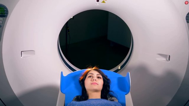 Medical MRI Scan being done on a young woman.