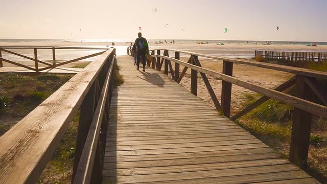 Surfers going to the sea. evening. slow motion