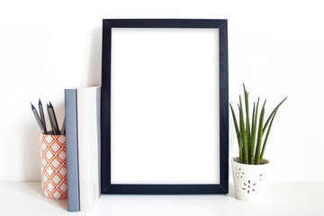 A4 black portrait frame on desk