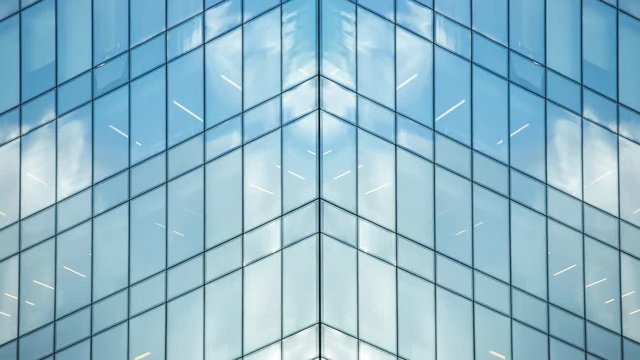 Timelapse Closeup Of Clouds Reflected In The Many Mirrors Of An Office Building