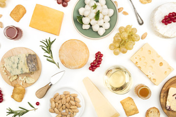 Various types of cheese with wine on a white background