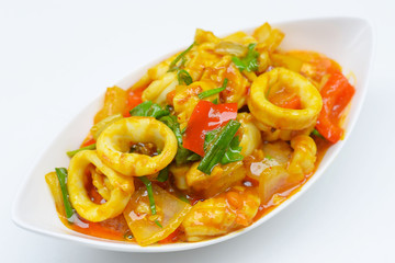 Stir fried fresh squid with yoke eggs ,onion and chili.
