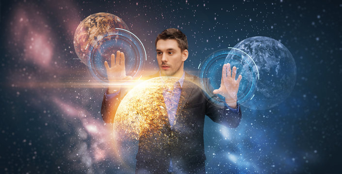 businessman with virtual planets and space - Powered by Adobe