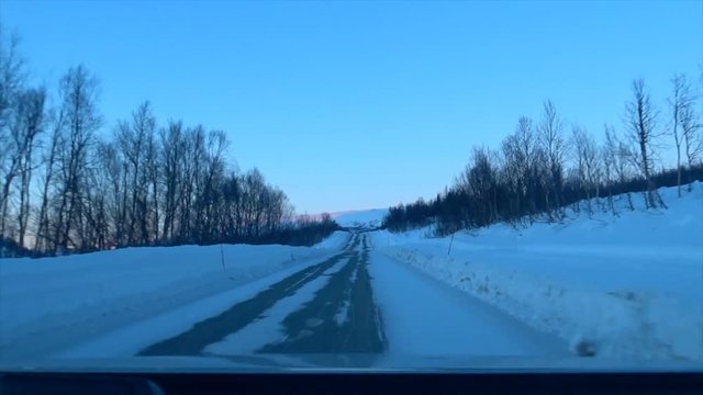 Driving on an icy road in Northern Norway during winter