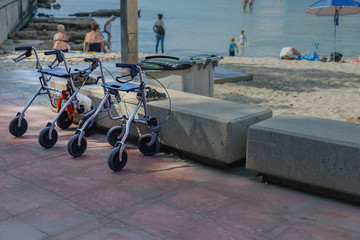 a device to facilitate walking of people with disabilities on the beach background