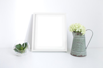 8x10" white portrait frame with vintage jug and flowers