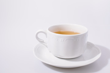 Cup of tea in a white background composition