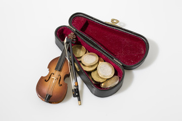 Fototapeta premium Cello instrument and coins composition