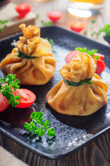 Pancakes with chicken and mushrooms, tied with green onions