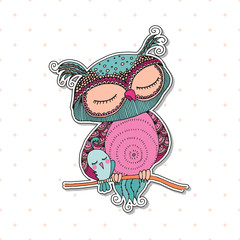 Cute colorful owl and little bird sitting on tree branch