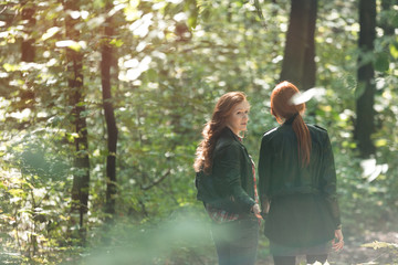 Girls talking in forest