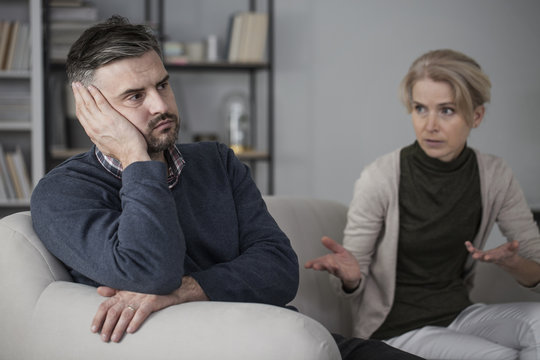 Upset man and complaining wife