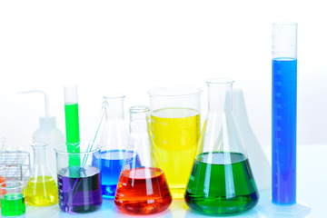 Laboratory glassware with colorful chemical reagent in research laboratory 
