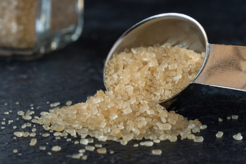 Turbinado Cane Sugar Spilled from a Teaspoon