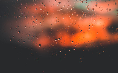 Raindrops On Window While Sunset