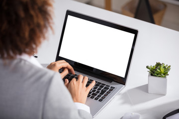 Businesswoman Working On Laptop With Blank Screen