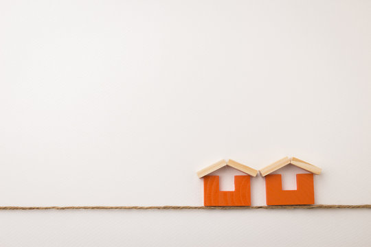 dual orange house icon on white space