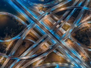 Aerial view Road roundabout, Expressway with car lots in the city in Thailand. Top view of traffic...