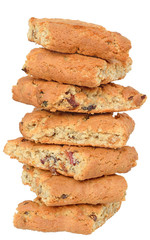 Appetizing chip cookies with raisins and candied fruit tower isolated