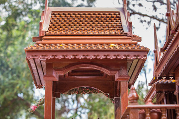 Beautiful Thai style spirit house or house of the guardian spirit is made of wood and sculptured...