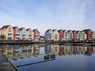 Colorful houses by the cold water and blue sky in Germany - obrazy, fototapety, plakaty