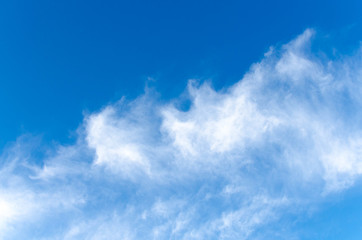 Blue skies wiht white clouds background.