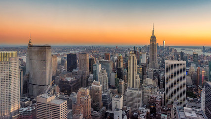 Fototapeta na wymiar New York City skyline with urban skyscrapers, panorama at sunset.