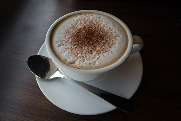 The cup of coffee.