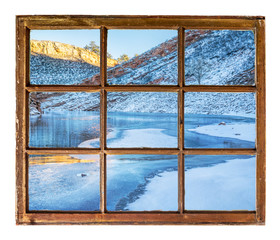 mountain lake in winter window view