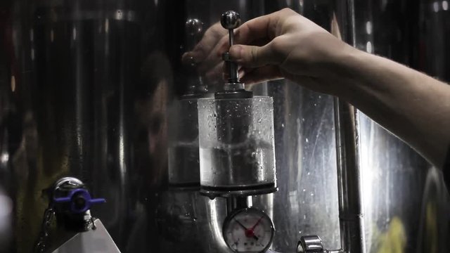making beer in the beer factory. Checking the pressure, boiling with water