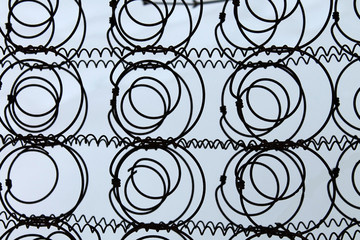 fence of metal wire on a white background